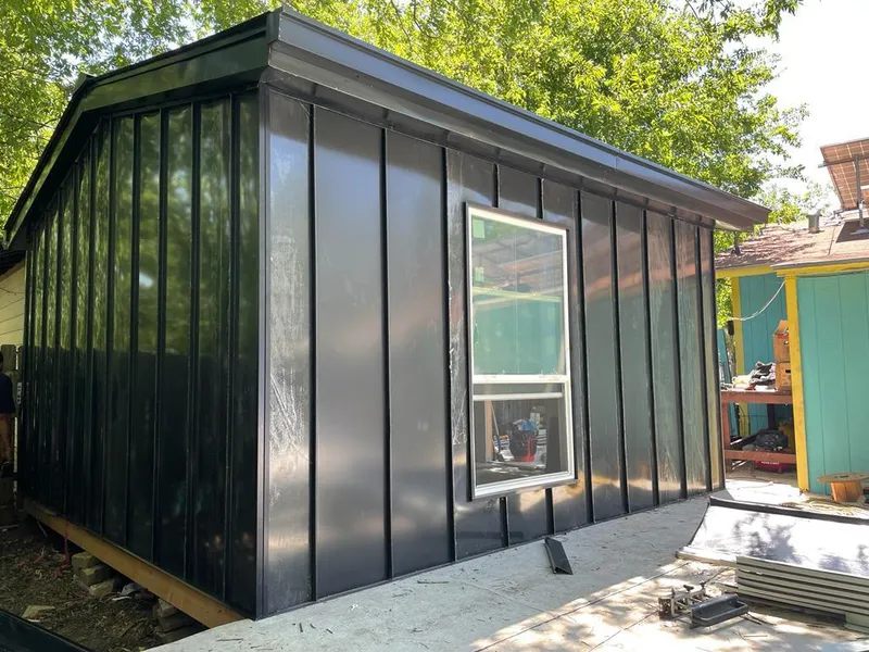 Black standing seam metal wall panels for Roof Inspection in Thomson