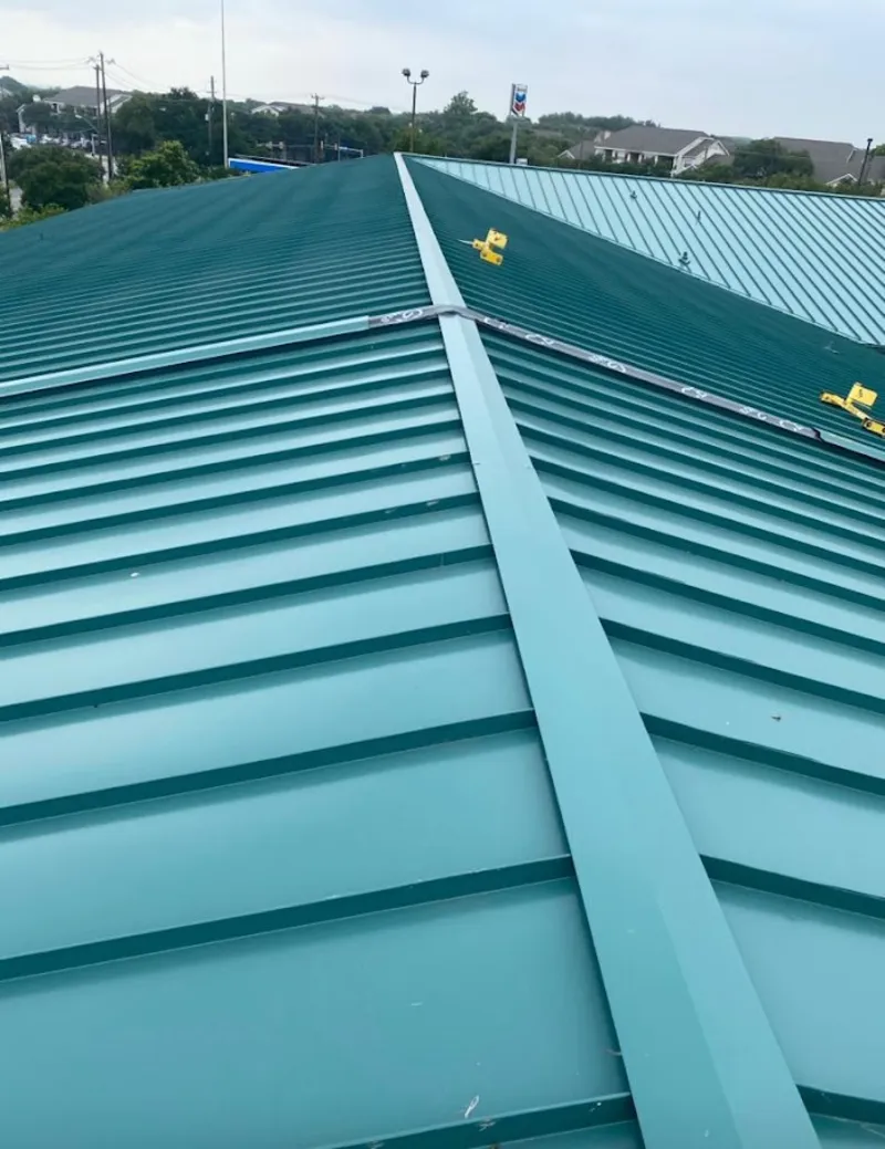Green commercial metal roof ridge and valley for Metal Roof Repair in Thomson